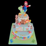 Torta decorata in pasta di zucchero per un compleanno a tema Mario